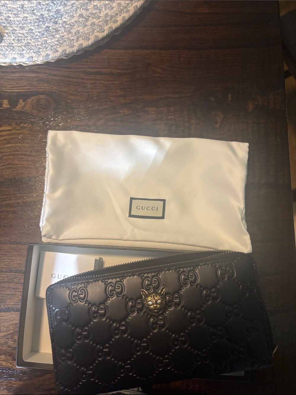 Gucci Black Embossed GG Leather Zip Wallet with Lion-Head Accent